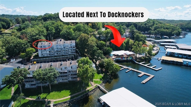 33 Crow Ct Unit 2E, Lake Ozark, MO 65049 - aerial view of a nearby body of water and a heavily wooded area