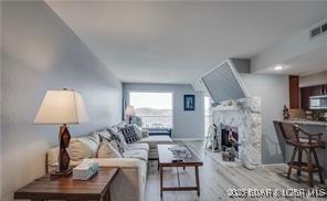 living room featuring a large fireplace