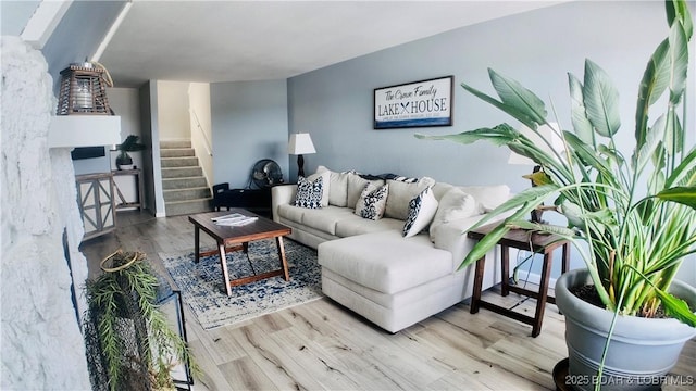 33 Crow Ct Unit 2E, Lake Ozark, MO 65049 - living room featuring wood finished floors and stairs