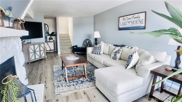 33 Crow Ct Unit 2E, Lake Ozark, MO 65049 - living area with wood finished floors and stairway