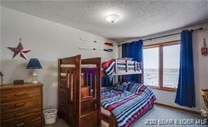 bedroom featuring a textured ceiling