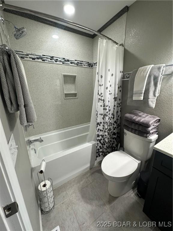 33 Crow Ct Unit 2E, Lake Ozark, MO 65049 - bathroom featuring shower / tub combo, vanity, a textured wall, and tile patterned flooring
