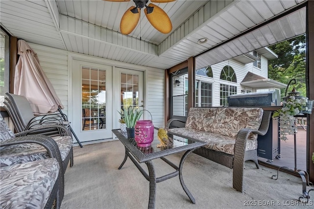 sunroom featuring ceiling fan