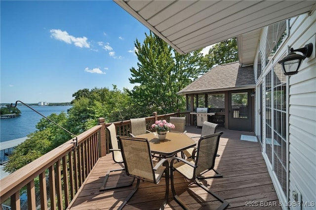 wooden deck featuring a water view