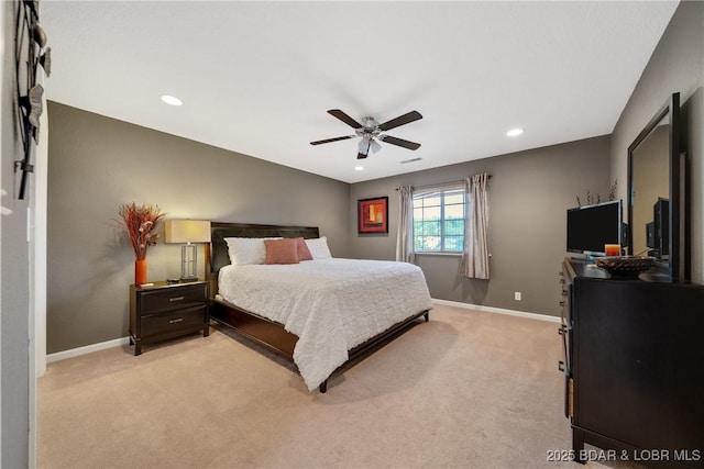 bedroom featuring light colored carpet and ceiling fan