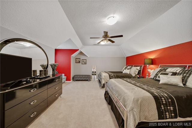 carpeted bedroom featuring ceiling fan, vaulted ceiling, and a textured ceiling