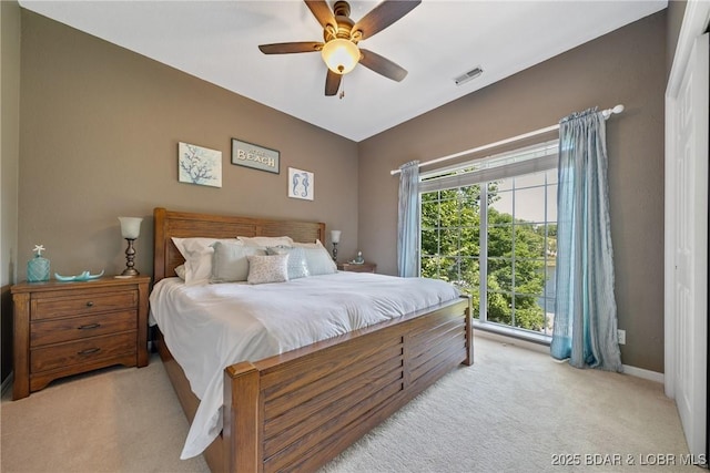 carpeted bedroom with ceiling fan