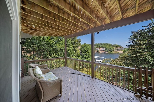 wooden deck with a water view