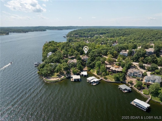 birds eye view of property featuring a water view