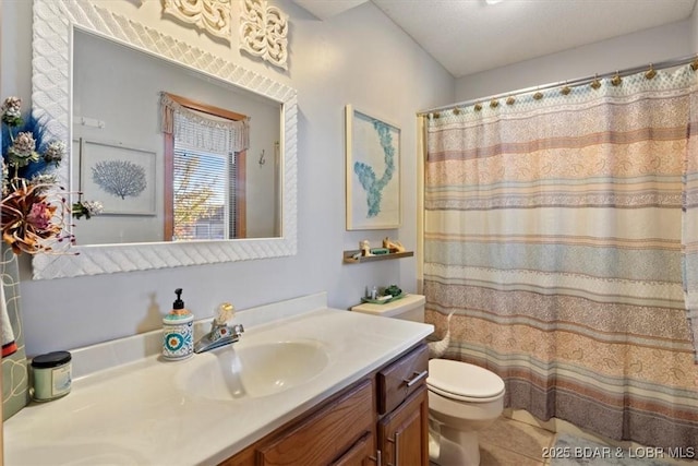 bathroom with vanity, a shower with shower curtain, tile patterned floors, and toilet