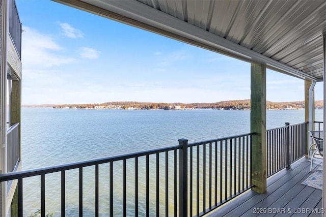 wooden deck with a water view