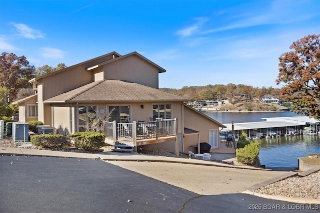 view of front of home featuring a deck with water view