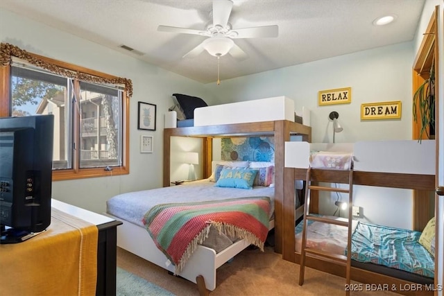 carpeted bedroom featuring ceiling fan