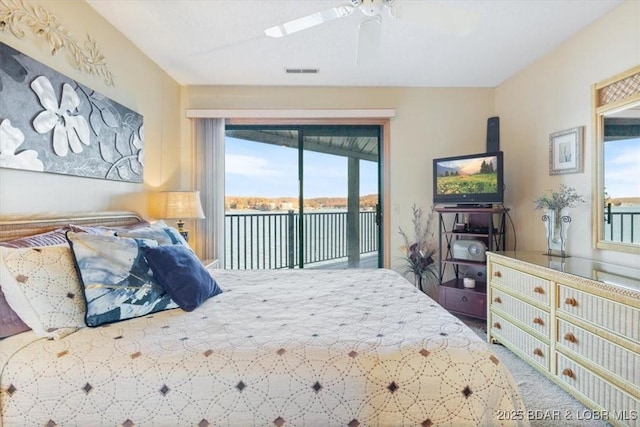 bedroom with multiple windows, carpet, access to exterior, and ceiling fan