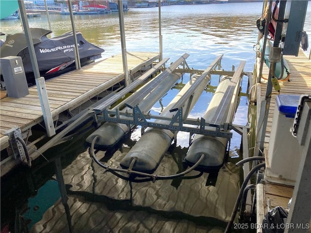 view of dock with a water view