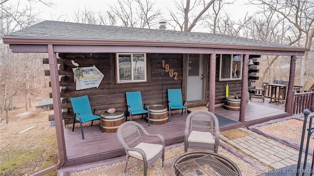 wooden terrace with a fire pit