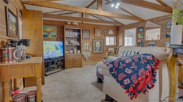 bedroom with lofted ceiling with beams, light carpet, and wooden walls