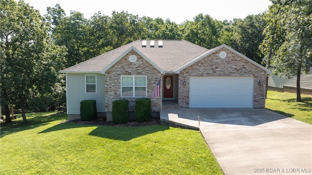 view of front of property featuring a garage and a front yard