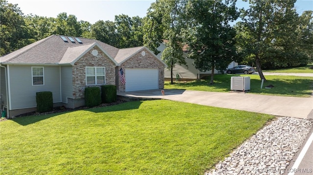 view of front of house with a garage and a front lawn