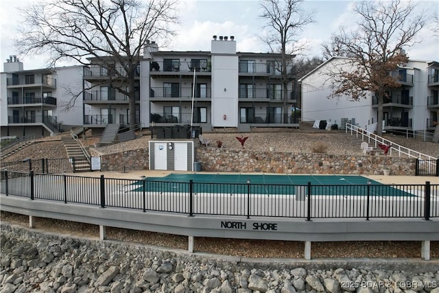 community pool featuring fence