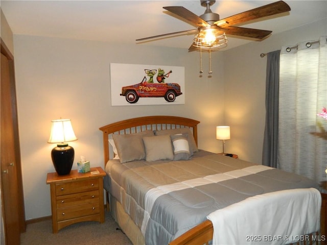 carpeted bedroom with a ceiling fan