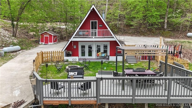 exterior space featuring french doors and a storage unit