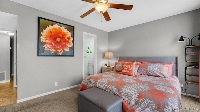 bedroom with ensuite bath, ceiling fan, and carpet