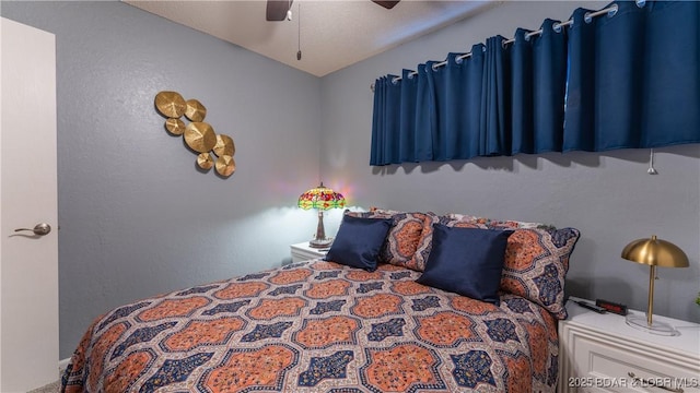 bedroom with vaulted ceiling and ceiling fan