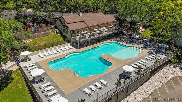 view of swimming pool featuring a patio area