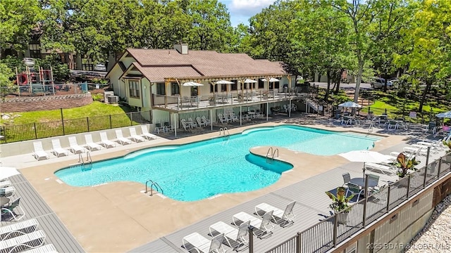 view of swimming pool featuring central AC and a patio area