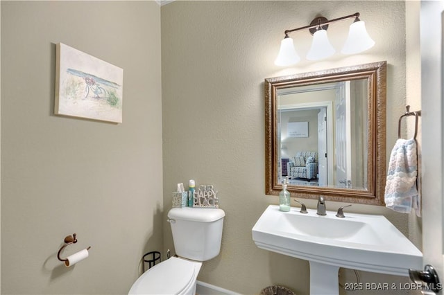 27112 White Horse Cir, Rocky Mount, MO 65072 - bathroom featuring toilet, a sink, and baseboards
