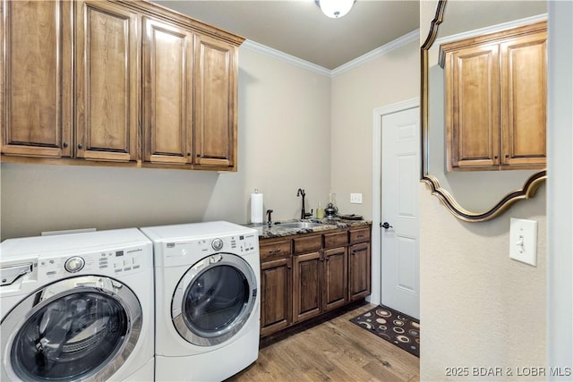27112 White Horse Cir, Rocky Mount, MO 65072 - washroom with cabinet space, light wood finished floors, crown molding, and washing machine and dryer