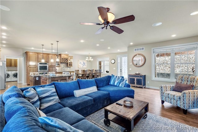 27112 White Horse Cir, Rocky Mount, MO 65072 - living area featuring washing machine and clothes dryer, recessed lighting, light wood finished floors, baseboards, and ceiling fan