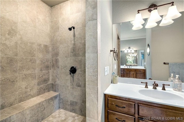 27112 White Horse Cir, Rocky Mount, MO 65072 - bathroom with tiled shower, vanity, crown molding, and a chandelier