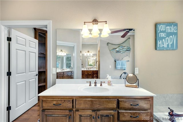 27112 White Horse Cir, Rocky Mount, MO 65072 - bathroom featuring vanity, ceiling fan, and a chandelier