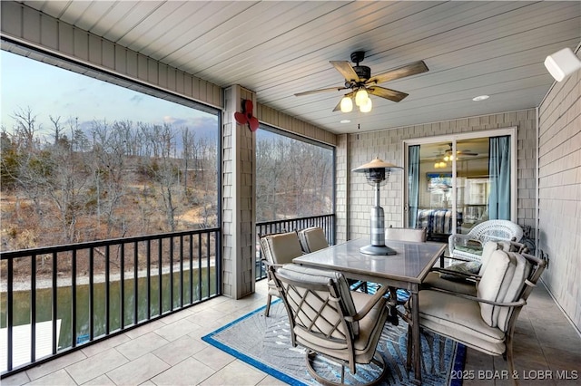 27112 White Horse Cir, Rocky Mount, MO 65072 - sunroom / solarium featuring a ceiling fan, plenty of natural light, and outdoor dining space