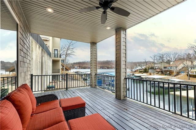 27112 White Horse Cir, Rocky Mount, MO 65072 - wooden terrace featuring a ceiling fan and a water view