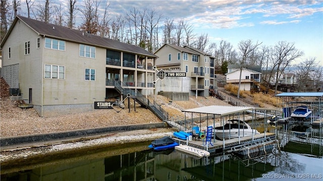 27112 White Horse Cir, Rocky Mount, MO 65072 - dock featuring stairs and a residential view