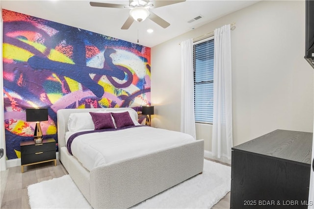 bedroom featuring recessed lighting, wood finished floors, visible vents, and a ceiling fan