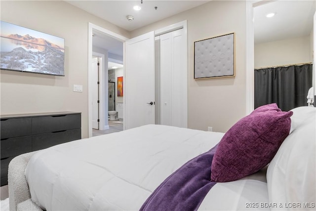 bedroom featuring recessed lighting, a closet, and connected bathroom