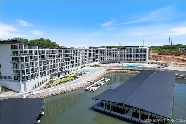 outdoor pool with a water view