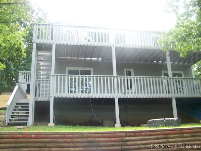 rear view of house with a wooden deck