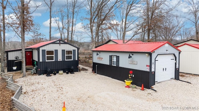 view of front facade with a garage and an outdoor structure