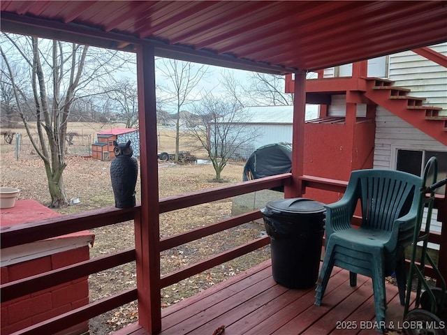 wooden deck with a grill