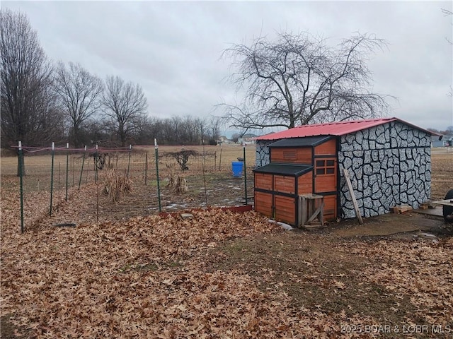 view of outbuilding with a rural view