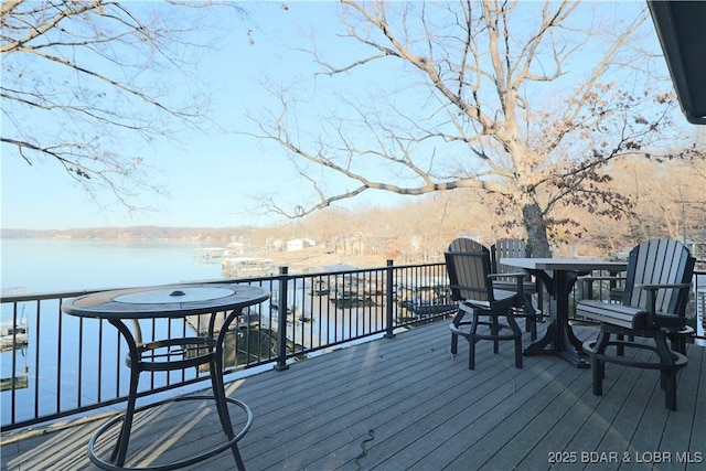 wooden deck featuring a water view