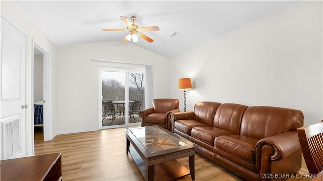 living room featuring light wood-type flooring, vaulted ceiling, and ceiling fan