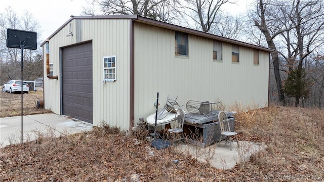 view of outbuilding featuring a garage