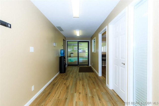 corridor featuring light hardwood / wood-style flooring