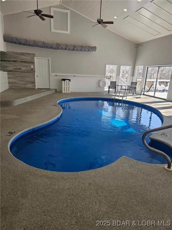 view of swimming pool featuring ceiling fan